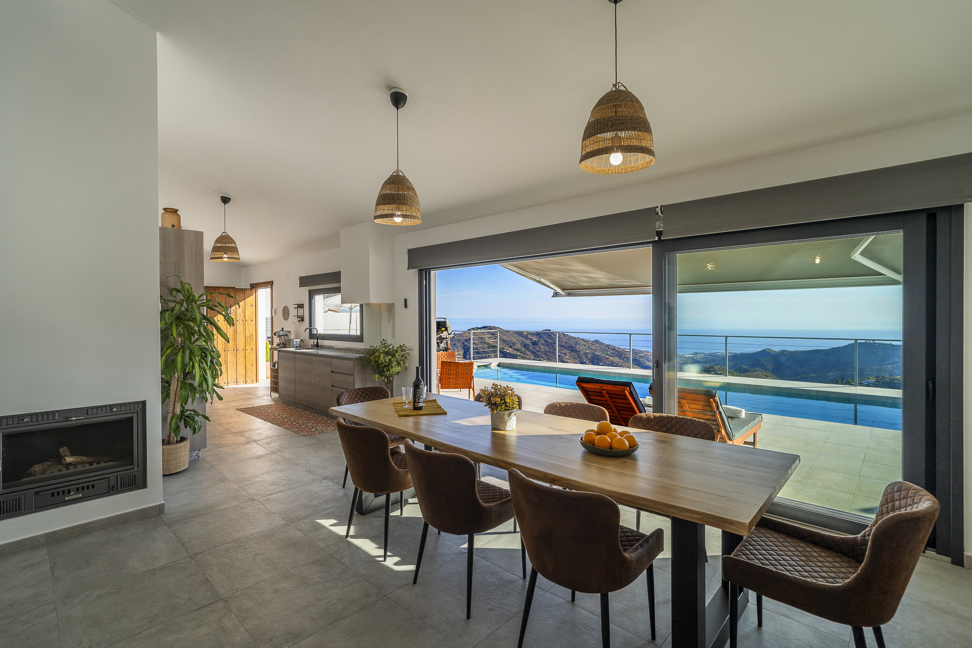 Living room with fireplace and pool views